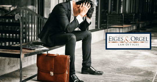 man with face in hands