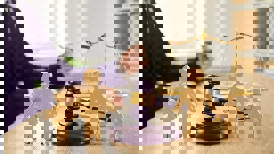 lawyer with family figures and a gavel