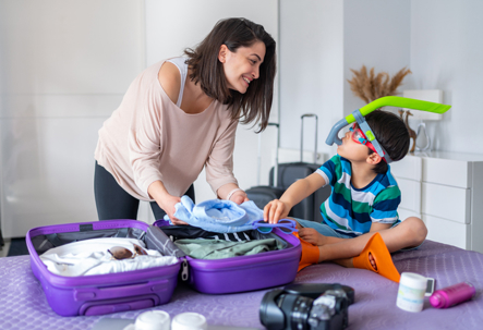 mother and son packing for summer travel