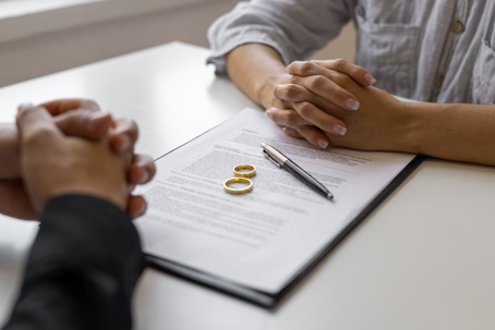 Divorced couple reviewing estate planning agreement
