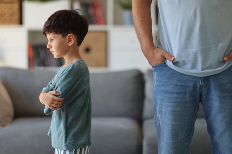 child turning away from father