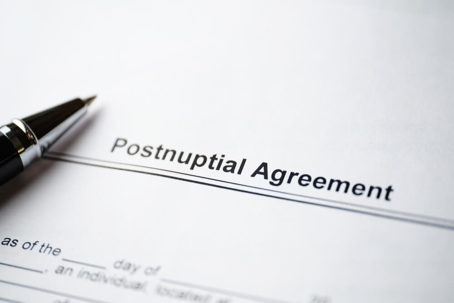 Photo of a postnuptial agreement with pen.